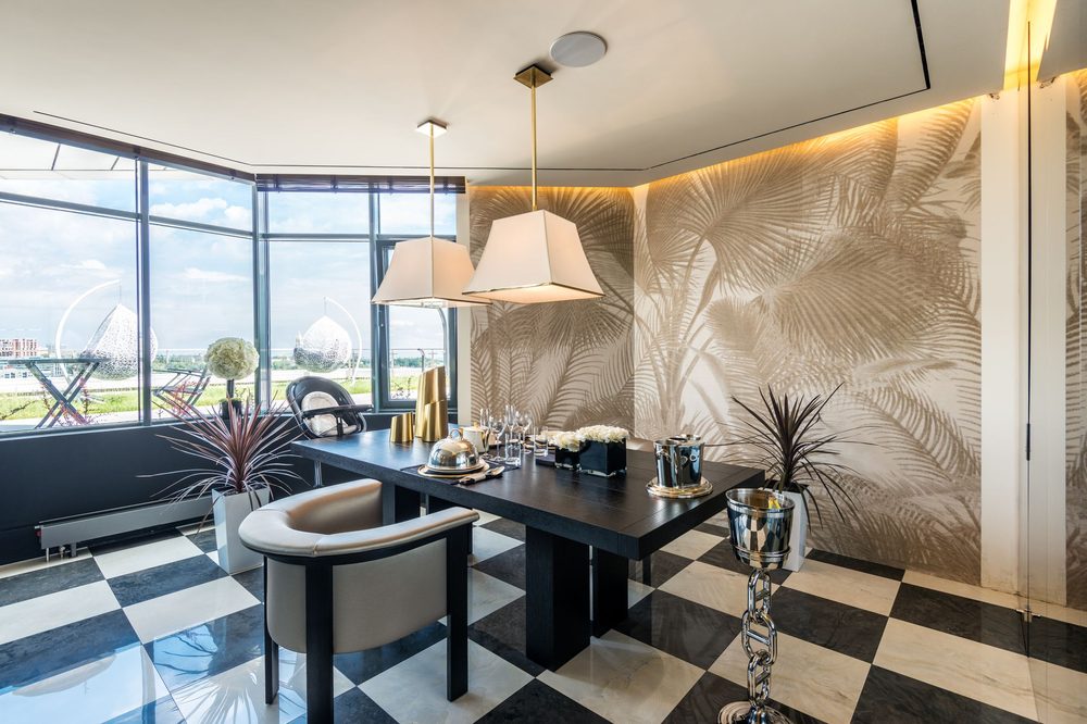 Dining room with a gold palm-leaf textured mural wallpaper